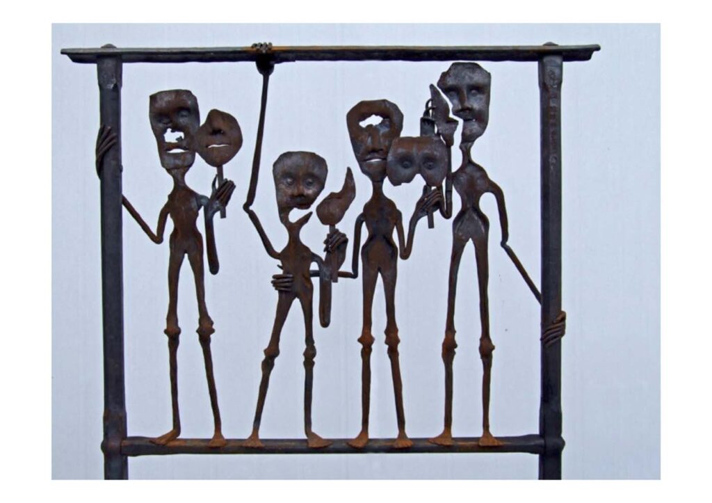 A steel sculpture of four disfigured people holding masks to cover over missing facial features.